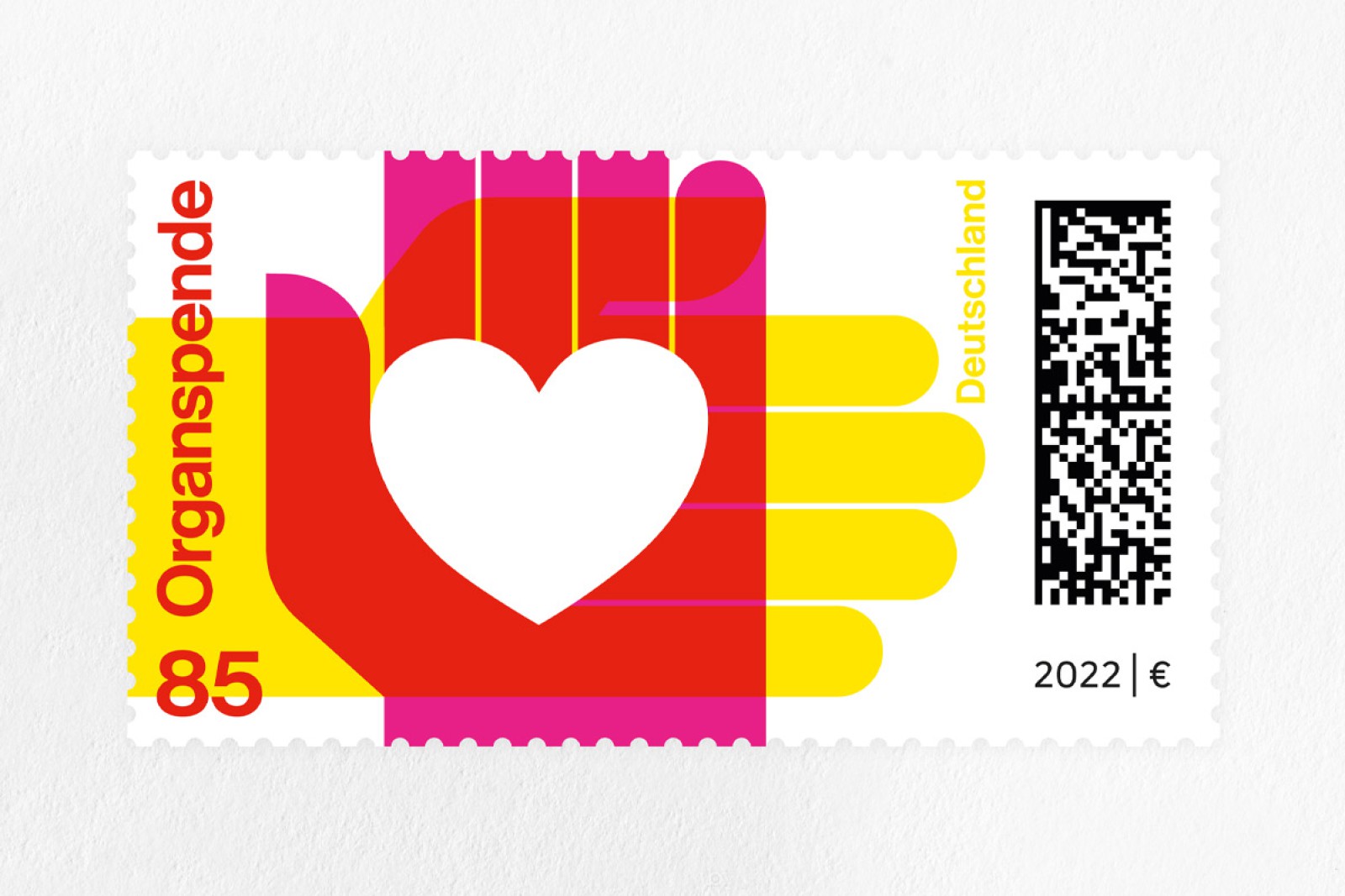 A special stamp issued by Deutsche Post on the theme of organ donation, with a face value of 85 cents: a stylized hand with a white heart in shades of red, pink, and yellow, issued in 2022