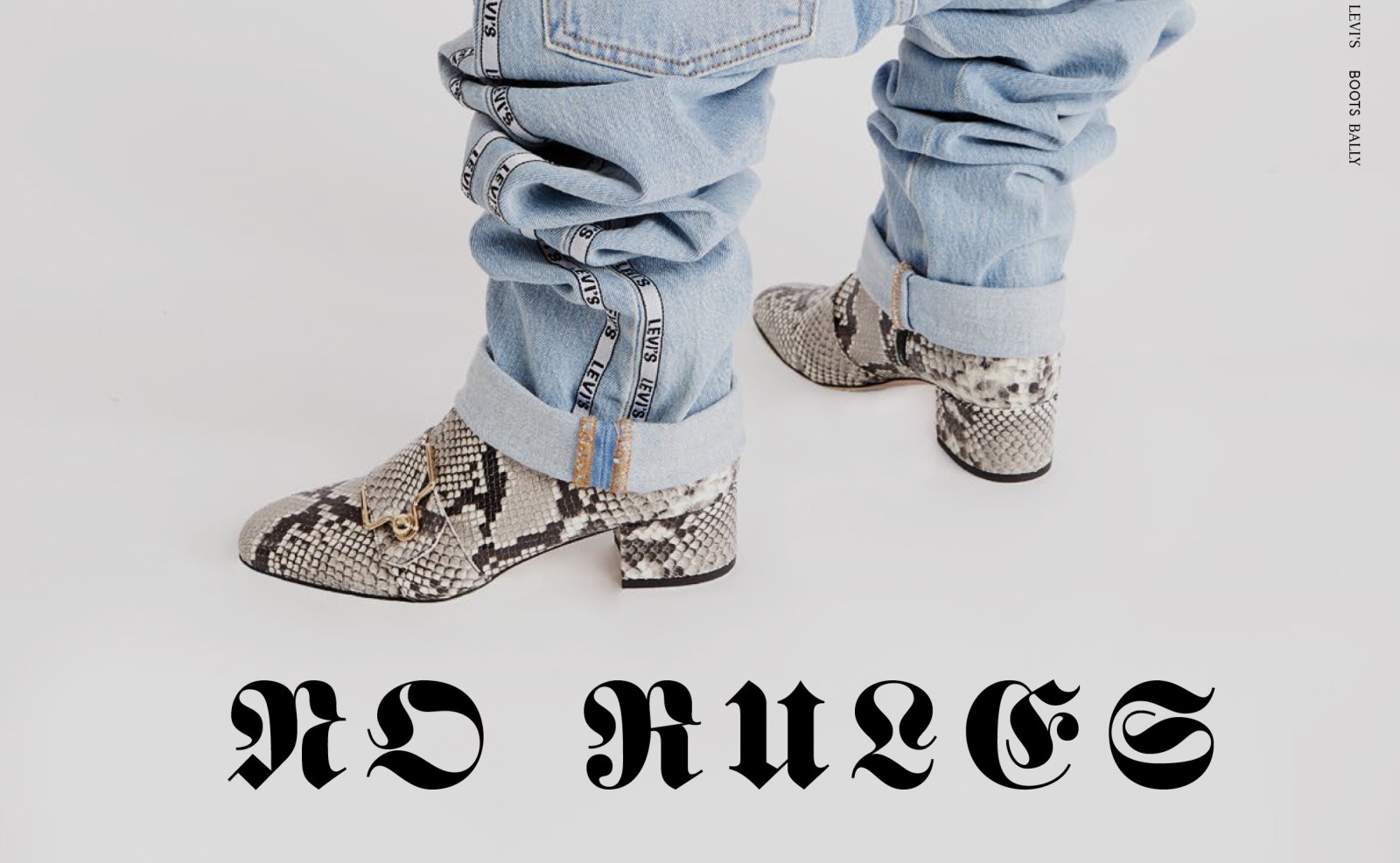 Close-up of a photo series featuring the typographic caption “No Rules”; the image shows the model wearing Levi’s jeans and snakeskin-patterned boots