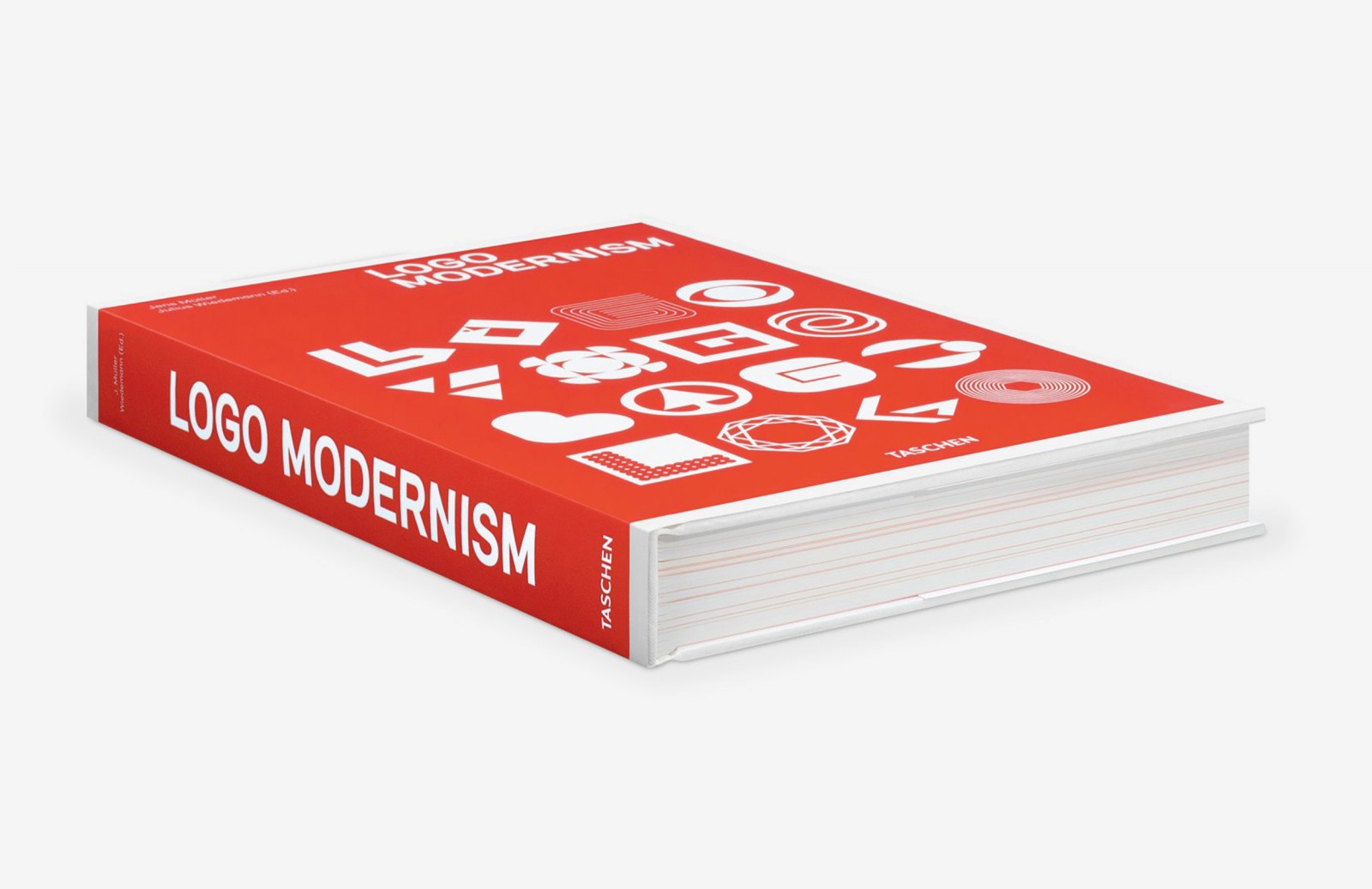 Three-dimensional oblique view of the book *Logo Modernism* (Taschen) lying flat: red cover with white geometric logos, showing the spine and side view of the large-format volume