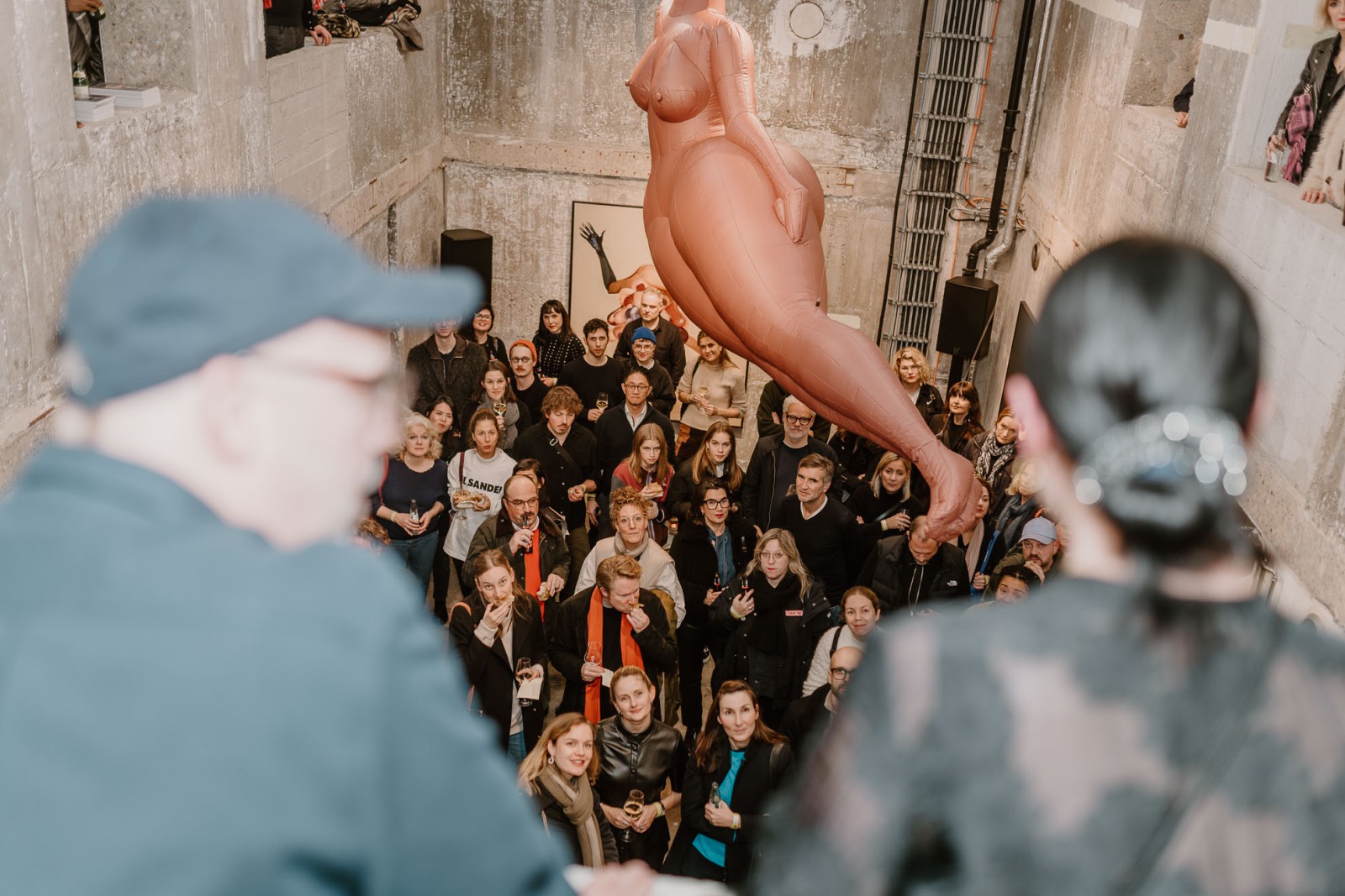 A group of guests at a release party for THE DORF THE MAG at the Bilker Bunker, with founders Tina and David blurred in the foreground